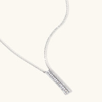 Baguette zirconia linear bar pendant necklace with clear stone side accents | Olaty