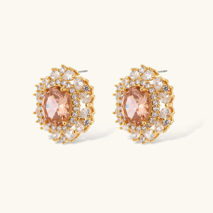 Close-up of vintage peach zirconia halo stud earrings with clear zirconia accents | Olaty