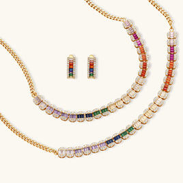 Rainbow baguette zirconia necklace bracelet and matching earrings arranged on a light background | Olaty
