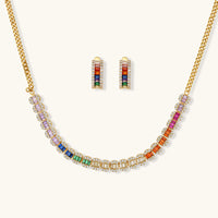 Multicolor baguette zirconia necklace with matching hoop earrings on a light background | Olaty