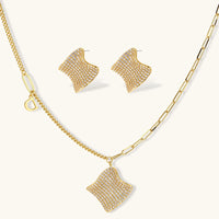 Wave pavé necklace and stud earrings set with clear cubic zirconia in gold tone | Olaty