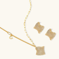 Sculptural wave necklace and matching pavé stud earrings with clear zirconia | Olaty