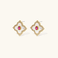 Close-up of clover stud earrings with pink center stones and clear zirconia accents | Olaty
