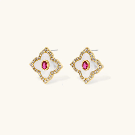 Close-up of clover stud earrings with pink center stones and clear zirconia accents | Olaty