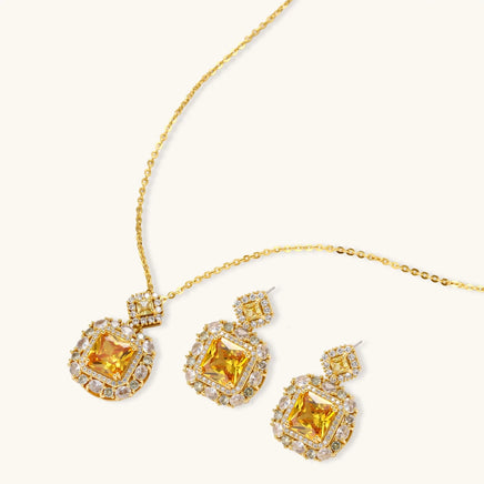Golden square Zirconia necklace and matching drop earrings surrounded by clear halo stones | Olaty