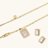 Emerald cut Zirconia pendant necklace and rectangular stud earrings displayed together | Olaty