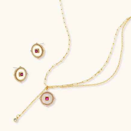 Ruby-red Zirconia medallion necklace and matching geometric stud earrings | Olaty