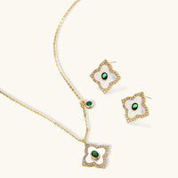 Floral necklace and stud earrings set with green zirconia and white petal details | Olaty