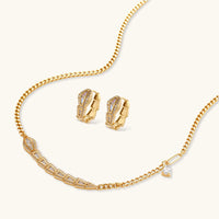Geometric zirconia necklace and earrings set with sculptural gold chain design | Olaty