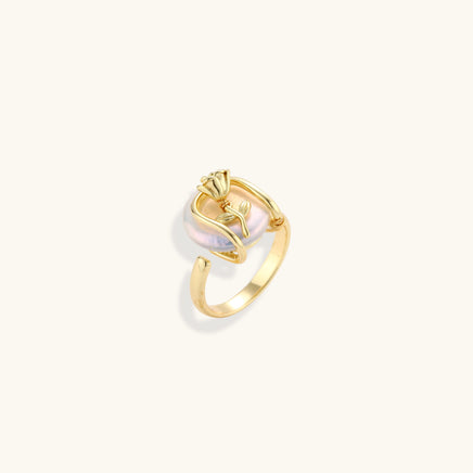 Sculptural Baroque Pearl rose statement ring with gold-plated floral cage shown at an angled view | Olaty