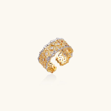 Two-tone lattice crystal statement ring with gold-tone geometric openwork and zirconia details, angled view | Olaty