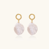 18K gold vermeil twisted circle studs with organic white baroque pearl drops on cream background