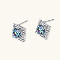 Angled pair of Rainbow Moissanite Diamond Prism Dreams Stud Earrings showing geometric halo settings and posts | Olaty