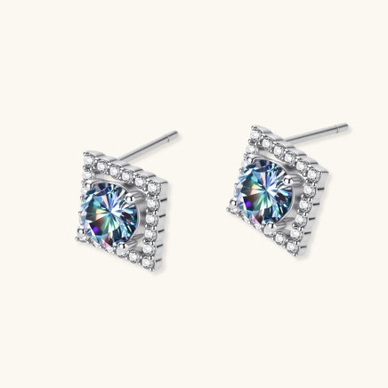 Angled pair of Rainbow Moissanite Diamond Prism Dreams Stud Earrings showing geometric halo settings and posts | Olaty