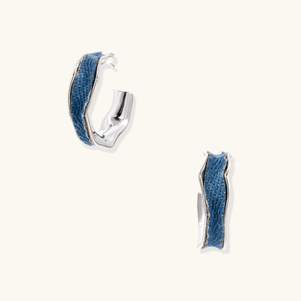 Denim sculpted hoop earrings with blue fabric inlay and polished silver-tone edges | Olaty