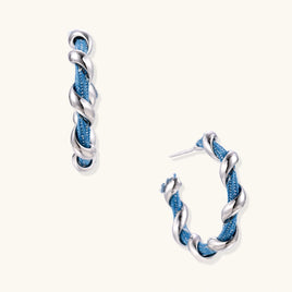 Denim twist hoop earrings with blue denim fabric wrapped in polished silver-tone sculptural spirals | Olaty