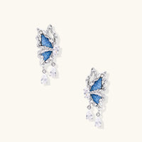 Blue denim sculptural butterfly drop earrings with silver-tone wings and sparkling zirconia drops | Olaty