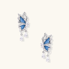 Blue denim sculptural butterfly drop earrings with silver-tone wings and sparkling zirconia drops | Olaty