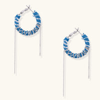 Front view of blue denim fabric hoop earrings with wrapped silver-tone chains and twin dangling chain details | Olaty