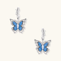 Blue denim butterfly drop earrings with zirconia centers and sculptural barbed wire inspired hoops | Olaty