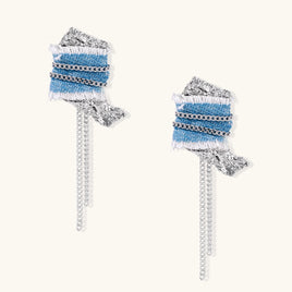 Blue denim statement drop earrings with silver-tone chain wraps, textured metal accents and cascading chain fringe | Olaty