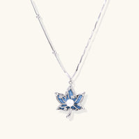 Denim lotus pendant necklace with blue fabric inlay, zirconia accents and silver-tone chain | Olaty
