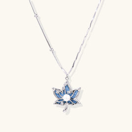 Denim lotus pendant necklace with blue fabric inlay, zirconia accents and silver-tone chain | Olaty