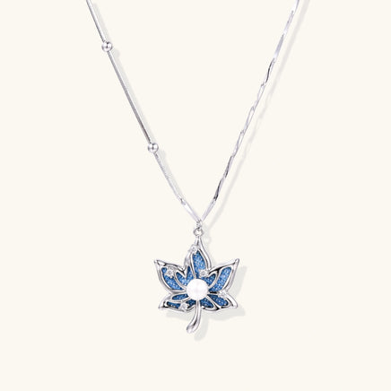 Denim lotus pendant necklace with blue fabric inlay, zirconia accents and silver-tone chain | Olaty