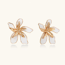 White enamel orchid statement stud earrings with sculptural gold-tone petals | Olaty