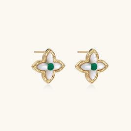 Gold-tone quatrefoil stud earrings with white Mother of Pearl petals and green gemstone centers, angled front view | Olaty
