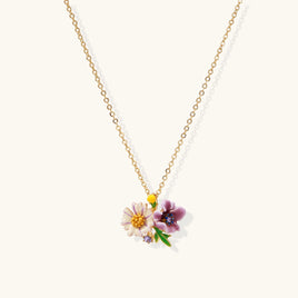 Close-up of colorful pink and purple floral bouquet pendant necklace with green leaf details | Olaty