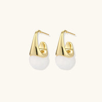 Sculptural cone hoop earrings with white resin drops shown at an angled side view | Olaty