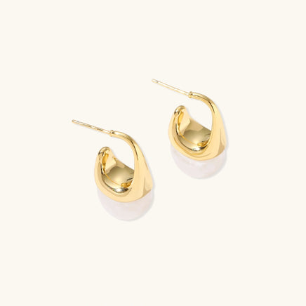 Sculptural cone hoop earrings with polished gold curves, white resin drops and visible posts | Olaty