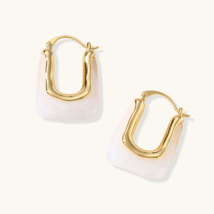 Liquid curve white resin hoop earrings showing open hoop shape and gold-tone frame | Olaty
