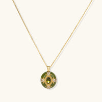 1. Emerald green oval pendant necklace with gold detailing and sparkling zirconia accents | Olaty