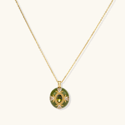 1. Emerald green oval pendant necklace with gold detailing and sparkling zirconia accents | Olaty