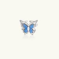 Front view of blue denim butterfly ring with clear zirconia center and sculptural silver-tone detailing | Olaty