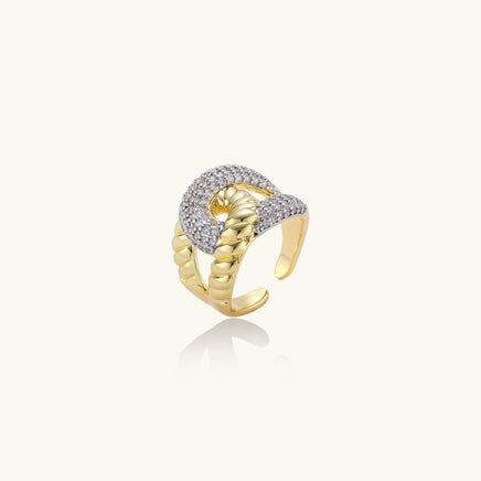 Angled view of sculptural chain link statement ring with gold-tone links and sparkling zirconia | Olaty