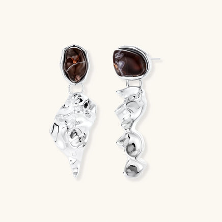 Silver-tone sculptural drop earrings with glossy brown resin tops and fluid abstract pendants | Olaty