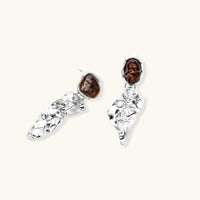Fluid art statement earrings featuring brown resin tops and polished abstract silver-tone drops | Olaty