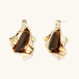 Molten gold-tone statement earrings with organic sculptural frames and elongated brown natural gemstones | Olaty