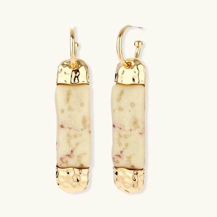 Gold-tone column drop earrings with cream marbled resin and hammered metal accents | Olaty