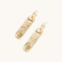 Angled view of cream marbled resin drop earrings with polished gold-tone hoop fittings | Olaty