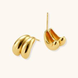 Angled view of Liquid Gold Sculptural Hoops showing the rounded dimensional silhouette | Olaty