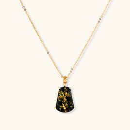 Forest Gold Amber Necklace with green amber pendant and 18K gold-plated 925 sterling silver chain on light background | Olaty