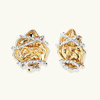 Sculpted rose statement stud earrings with molten gold-tone petals and contrasting silver-tone wraps | Olaty