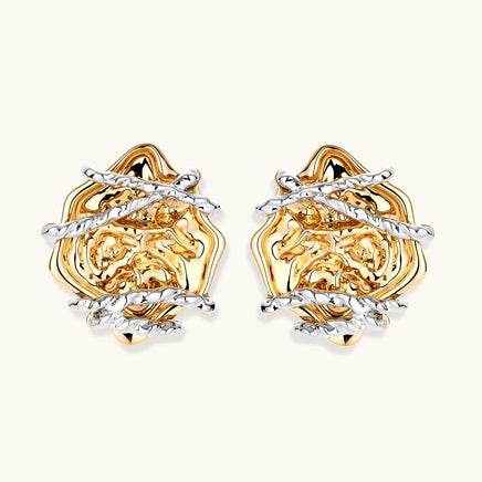 Front view of two-tone rose statement earrings with layered gold petals and twisted silver-tone details | Olaty