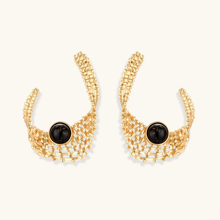 Front view of sculptural gold statement earrings with black resin centers and architectural woven mesh design | Olaty