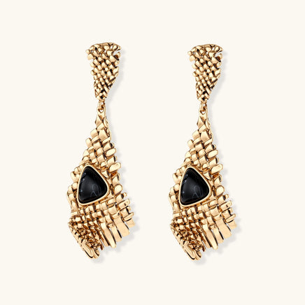 Front view of long gold-tone grid earrings featuring triangular black resin centerpieces | Olaty