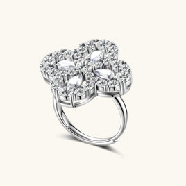 Adjustable sterling silver ring with quatrefoil design featuring brilliant moissanite stones in clover pattern
